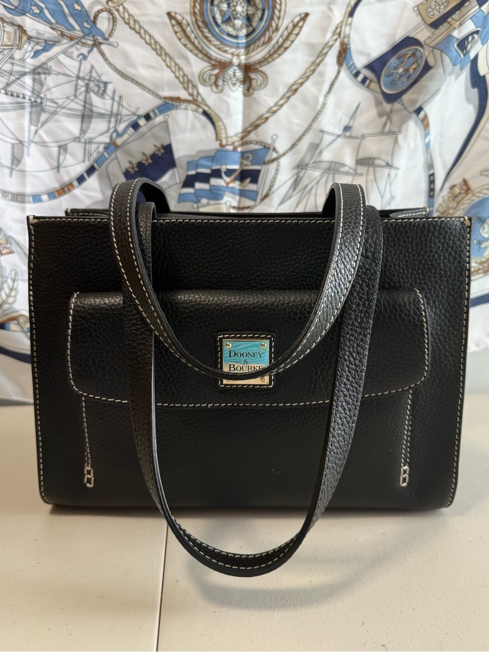 Dooney & Bourke Black Pebbled Leather Shoulder Bag with Front Pocket and Logo